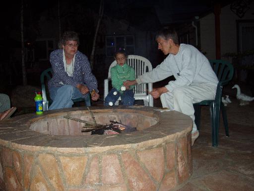 P6030060 Roasting marchmallows, Gramma, Josephine, and Robin